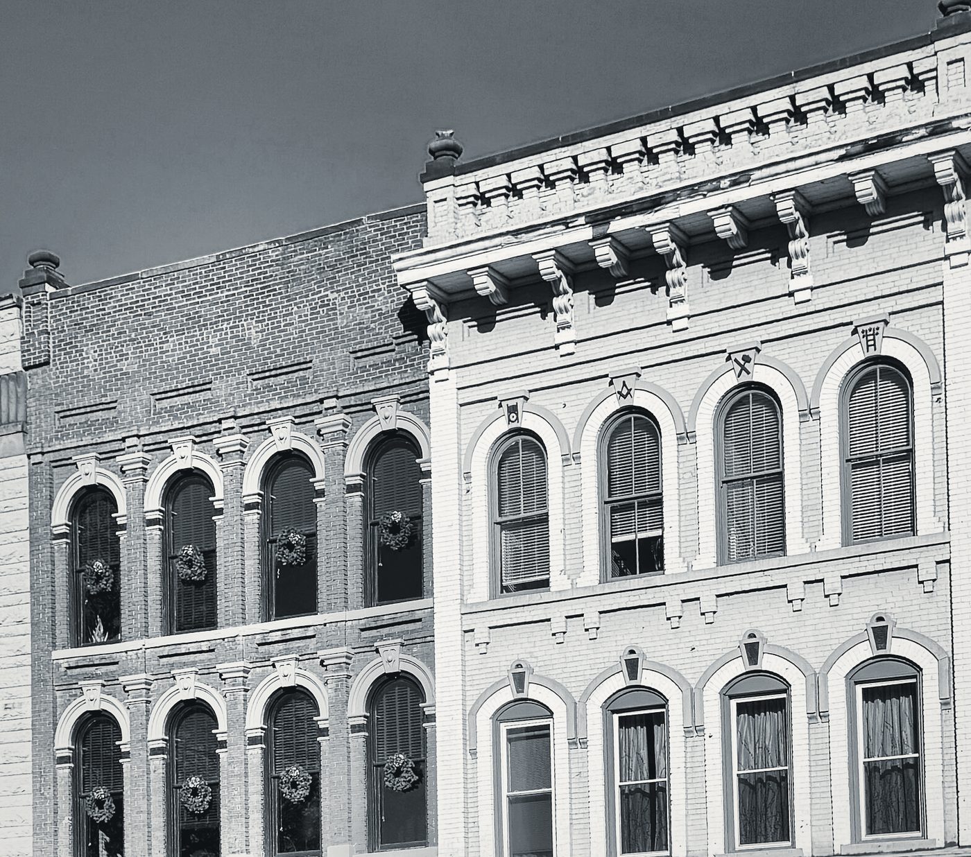 Italianate brick blocks on Front Street in Marietta, arched upper windows under a bracketed cornice